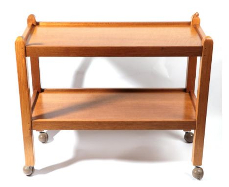 Mouseman: A Robert Thompson of Kilburn English Oak Tea Trolley/Dinner Wagon, with two tiers both with raised sides joined by 