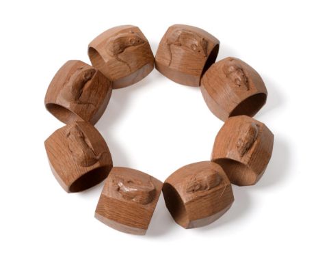 Mouseman: Eight Robert Thompson of Kilburn English Oak Napkin Rings, of standard octagonal form, each with carved mouse signa