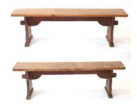 Mouseman: A Pair of Robert Thompson of Kilburn English Oak Benches, on two shaped supports joined by a pegged under stretcher