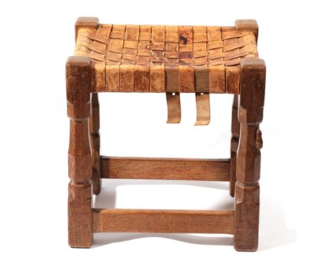 Mouseman: A Robert Thompson of Kilburn English Oak Stool, strap leather top, on four octagonal legs joined by stretchers, wit