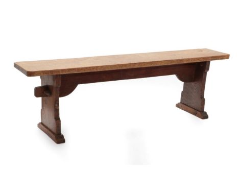 Mouseman: A Pair of Robert Thompson of Kilburn English Oak Benches, on two shaped supports joined by a pegged under stretcher