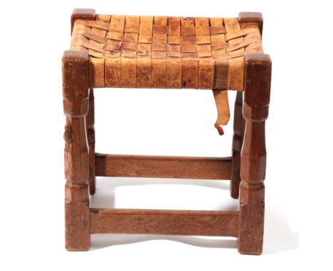 Mouseman: A Robert Thompson of Kilburn English Oak Stool, strap leather top, on four octagonal legs joined by stretchers, wit
