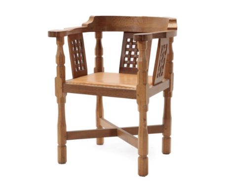 Mouseman: A Robert Thompson of Kilburn English Oak Monks Chair, with curved back and shaped arms, over three lattice panels, 