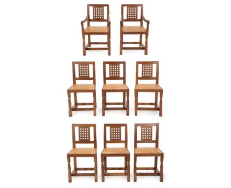 Mouseman: A Set of Eight (6+2) Robert Thompson of Kilburn English Oak Lattice Back Dining Chairs, cow hide seats, on turned o