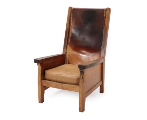 Mouseman: A Robert Thompson of Kilburn English Oak Smoker's Chair, slung leather back, straight arms, cow hide covered cushio