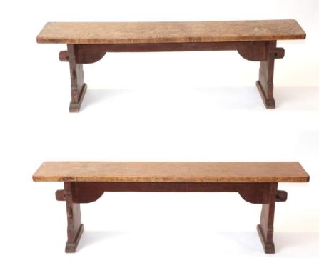 Mouseman: A Pair of Robert Thompson of Kilburn English Oak Benches, on two shaped supports joined by a pegged under stretcher