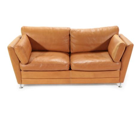 A 1970's Danish Stouby Two-Seater Sofa, upholstered in natural tan leather, with six cushions, 177cm by 89cm by 87cm