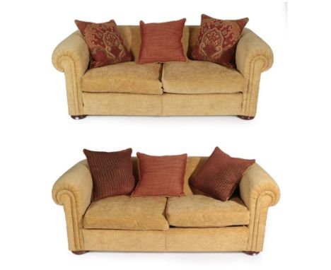 A Pair of Duresta Maximus Feather-Filled Two-Seater Sofas, circa 2003, covered in light gold chenille type fabric, with rever