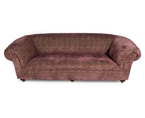 A Chesterfield Style Sofa, modern, covered in a good quality pink and gold leopard print style fabric, with rounded arms, on 