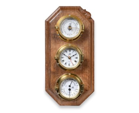 Mouseman: A Robert Thompson of Kilburn English Oak Barometer/Hygrometer/Thermometer, a brass mounted weather centre with Plas