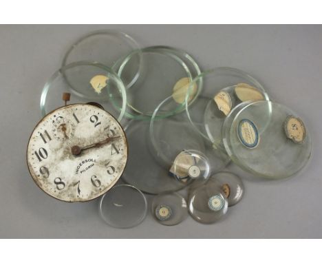 A collection of watchmakers tools, watch glasses etc