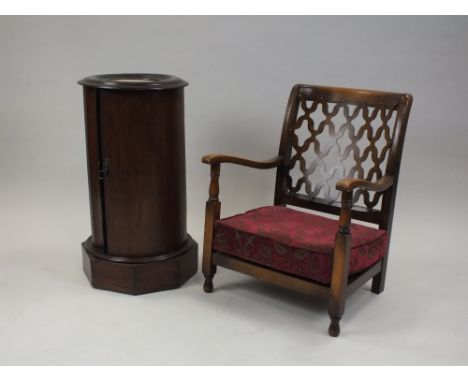 A Victorian mahogany and marble inset pillar box bedside cabinet with dished top and bow-front door enclosing a shaped shelf 