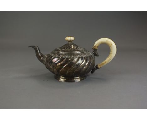 A French silver teapot, of wrythen circular form with ivory handle and finial, weight 19.8oz