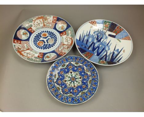 Two Japanese Imari chargersMeiji/Taisho periodThe first decorated with narcissus flowers between fan panel borders, 37cm dia.