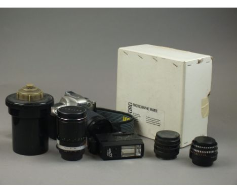 A collection of photography equipment including a Nikon F55 35mm SLR camera with Nikkor 28-100 AF lens, tripod, accessories a