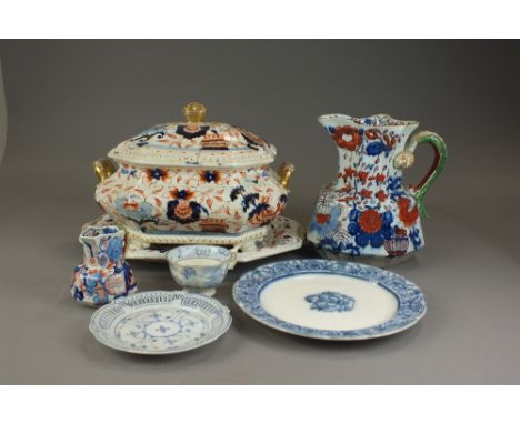 A late 19th century earthenware English dinner service transfer-printed in underglaze blue, German porcelain plates with reti