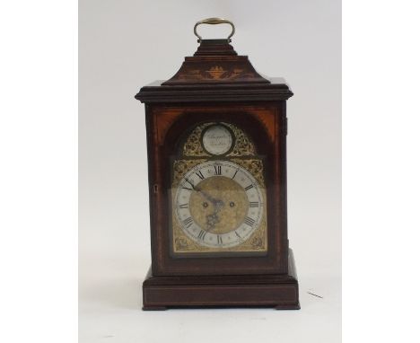 An Edwardian mahogany and inlaid bracket clock in George III style, pagoda top case with swing carrying handle above an arche