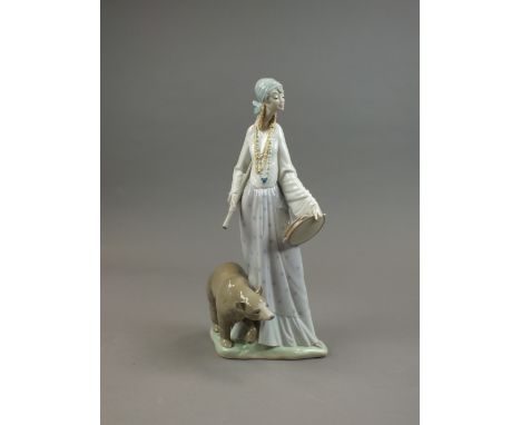 A Lladro figure of a 'Gypsy Woman' with a bear, model No 4919, sculpted Salvador Debon, issued 1974-1981, 36.5cm high, boxed