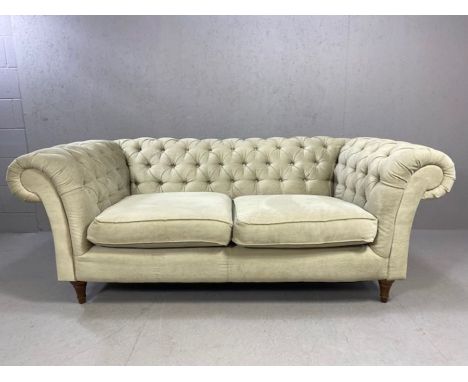 Chesterfield style two seater sofa upholstered in light grey fabric, approx 195cm x 100cm x 78cm 