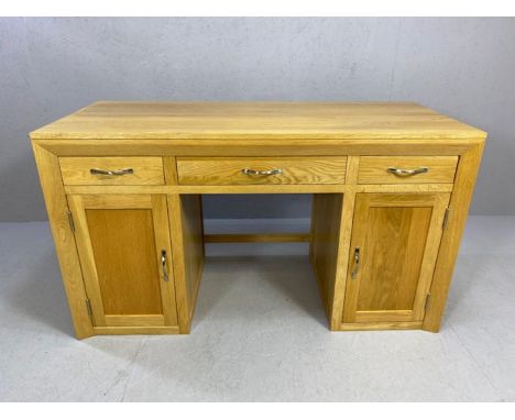 Modern solid light oak desk with chrome handles, three drawers and two cupboards.  Excellent condition, approx 140cm x 60cm x