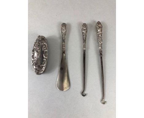 Collection of silver handled fully hallmarked items to include button hooks, nail buffer, and shoe horn.