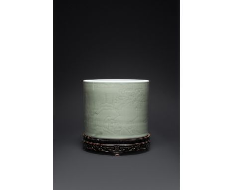 A FINE AND RARE CHINESE CARVED CELADON BRUSHPOT, BITONG KANGXI 1662-1722 The wide cylindrical body decorated with a continuou