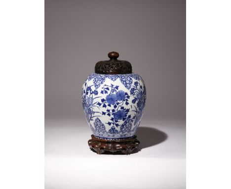 A CHINESE BLUE AND WHITE 'LOTUS' VASE KANGXI 1662-1722 Decorated with three large lotus sprays divided by chrysanthemum, the 