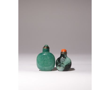 A CHINESE JADEITE SNUFF BOTTLE AND A GLASS SNUFF BOTTLE QING DYNASTY Each of flattened rounded shape, the icy-green jadeite s