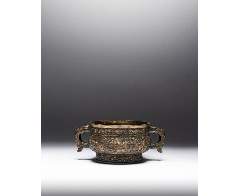 A HEAVILY CAST CHINESE PARCEL-GILT BRONZE 'MYTHICAL BEAST' INCENSE BURNER, GUI 17TH CENTURY The compressed circular body, cas