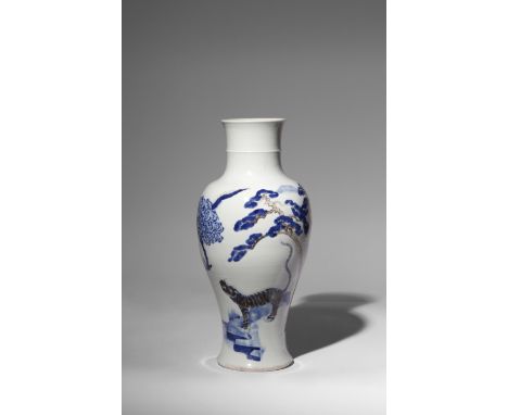 A RARE CHINESE BLUE AND WHITE, CELADON AND UNDERGLAZE COPPER-RED BALUSTER VASE KANGXI 1662-1722 The body painted and carved w