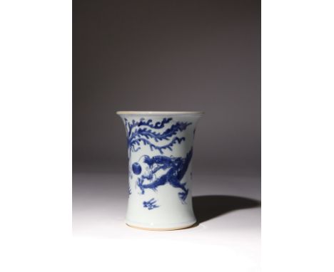 A CHINESE BLUE AND WHITE 'DRAGON AND PHOENIX' BRUSHPOT, BITONG KANGXI 1662-1722 The waisted body flaring at the foot and towa