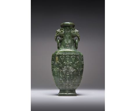 A LARGE CHINESE SPINACH-GREEN JADE VASE QIANLONG 1736-95 The flattened baluster body carved in relief with a continuous styli