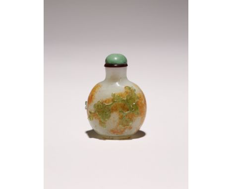A SMALL CHINESE OVERLAY GLASS SNUFF BOTTLE 18TH CENTURY The ovoid body in a pale celadon coloured glass with a brown skin imi