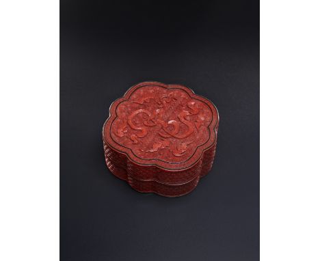 PLEASE NOTE HIS LOT IS NOW TO BE OFFERED WITHOUT RESERVE. A CHINESE CINNABAR LACQUER FOLIATE BOX AND COVER QIANLONG 1736-95 T