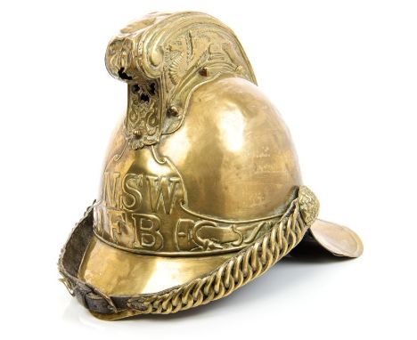 Early 20th century brass firemens' helmet with embossed dragon decoration to comb, name plate to front 'NSWFB' believed to be