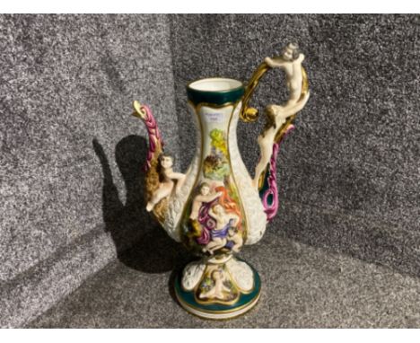 Majestical Capodimonte Italian marked porcelain pitcher with cherub design, Height 52cm x Width 30cm