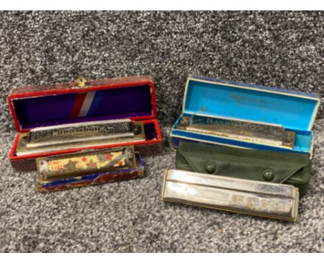 A lot consisting of 4 harmonica to include Echo, Super Chromonica etc