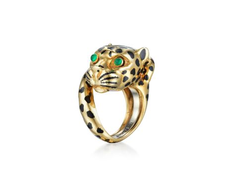 Crafted out of 18K yellow gold, with black enamel spots and emerald cabochons for the eyes; ring size 6, width measures 3/4 i