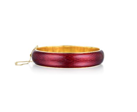Crafted out of 18K yellow gold with red enamel and Guilloche pattern like on the gold; circumference measures 7 inches, width