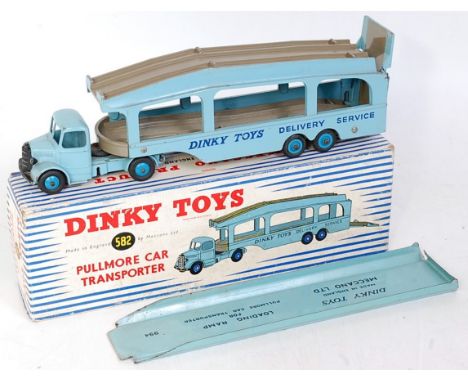 A Dinky Toys No. 582 Pullmore car transporter comprising light blue and dark grey body with Dinky Toys Delivery Service liver