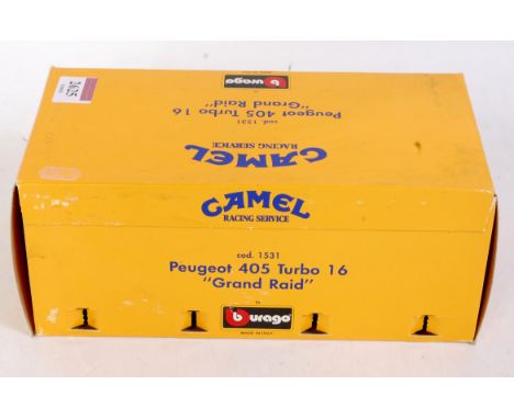 A Bburago 1/24 scale model of a Peugeot 405 turbo 16 Grand Raid, with camel racing service livery, in the original all-card b