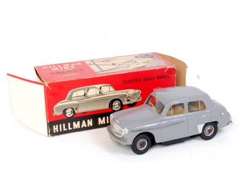 A Victory Models 1/18 scale model of a Hillman Minx Deluxe saloon battery operated example, comprising grey body with yellow 