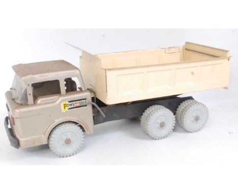 A Marx Toys large press steel model of a scissor hydraulic dump truck  finished in silver, cream and black with grey plastic 