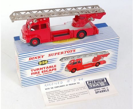 A Dinky Toys No. 956 turntable fire escape engine with windows comprising red and silver body with red plastic hubs with chro