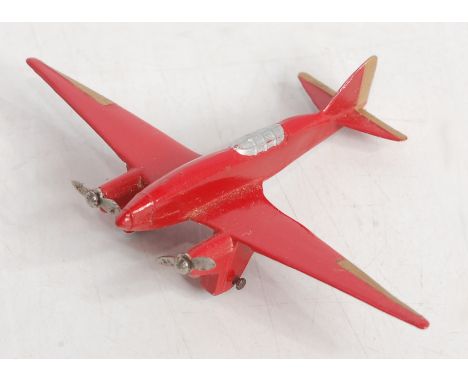 A Dinky Toys No. 60G light racer, finished in red with 2x twin blade propellers, some light restoration evident