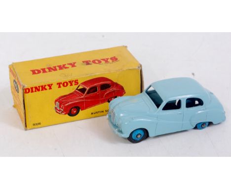 A Dinky Toys No. 40J Austin Somerset saloon comprising light blue body with mid blue hubs missing one tyre, in the original a