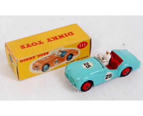 A Dinky Toys No. 111 Triumph TR2 sports vehicle comprising turquoise light blue body, with red hubs and red interior, racing 