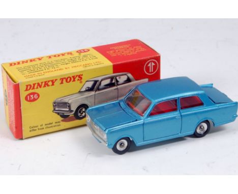 A Dinky Toys No. 136 Vauxhall Viva comprising light metallic blue body, red interior and spun hubs, in the original red & yel