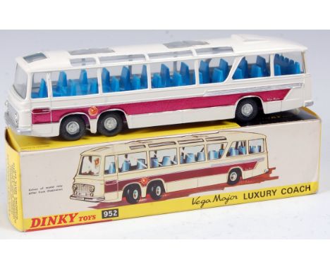 A Dinky Toys No. 952 Vega Major luxury coach, comprising white body with purple side flashes and detailed hubs, blue interior