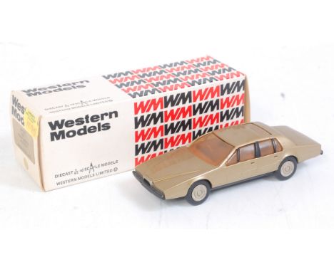 A Western Models 1/43 scale model of a WP100 1977 Austin Martin Legonda finished in gold in the original foam packed box 